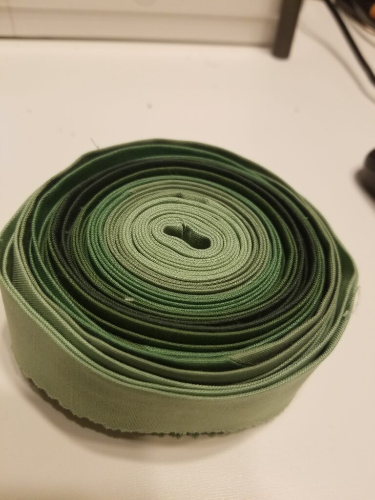 A roll of green quilt binding.