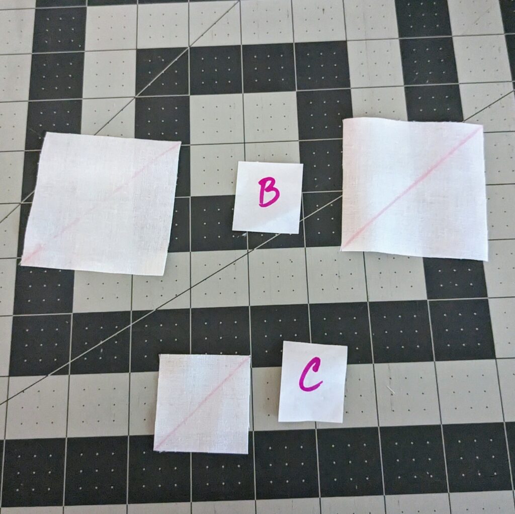 Pieces B and C with the diagonal line drawn on them.