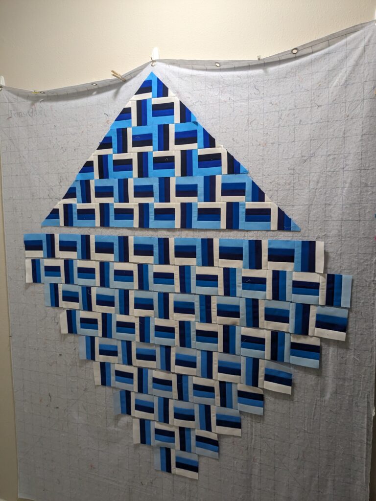 The partially sewn quilt on my design wall.